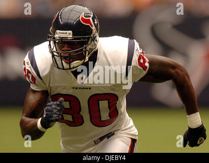 HOUP2002090801 - Houston, Sept. 8, (UPI) -- Houston Texans quarterback  David Carr (8) tries to escape the Dallas Cowboys defense during the 2nd  quarter on Sept. 8, 2002, in Houston. The Texans