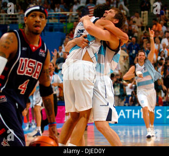 Aug 27, 2004; Athens, GREECE; Manu Ginobili, Tim Duncan and Stephon Marbury  mix it up during the Men's Basketball semifinals. Argentina beat the  American team 89-81 to advance to the gold medal