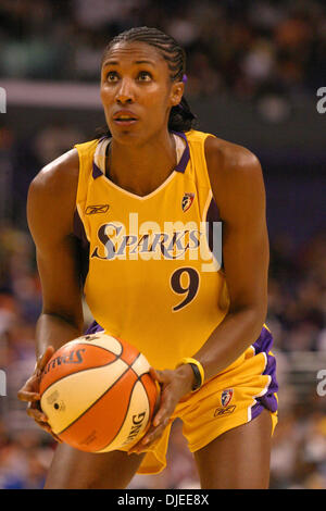 Los Angeles Sparks' Lisa Leslie, right, tries to get a rebound against  Phoenix Mercury's Jennifer Lacy in the first half of a women's basketball  game in Los Angeles on Friday, June 30