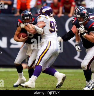 Oct 10, 2004; Houston, TX, USA; NFL Football: Texan QB David Carr is stopped by Viking DT Chris Hovan during the second half at Reliant Stadium in Houston. Stock Photo