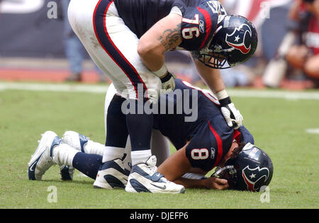 Oct 10, 2004; Houston, TX, USA; NFL Football: Houston Texans C, Steve McKinney, checks on Qb David Carr after he was sacked by Minnesota during the second half at Reliant Stadium in Houston. Stock Photo