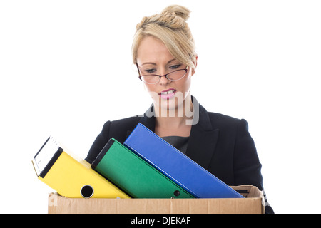 Model Released. Young Business Woman Carrying a Box of Files Stock Photo