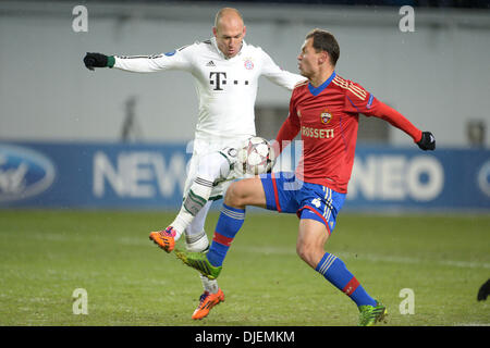 Moscow, Russia. 27th Nov, 2013. Moscow's Sergei Ignashevich and Munich's Arjen Robben (L) vie for the ball during the UEFA Champions League Group D soccer match between CSKA Moscow and FC Bayern Munich at Arena Chimki in Moscow, Russia, 27 November 2013. Photo: Andreas Gebert/dpa/Alamy Live News Stock Photo