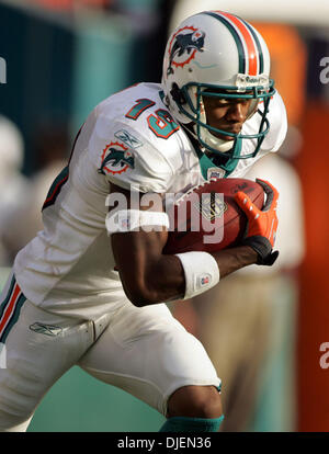 Miami Dolphins kick returner Ted Ginn Jr returns this punt in second half  action against the New England Patriots at Landshark stadium in Miami on  December 6, 2009. The Dolphins defeated the