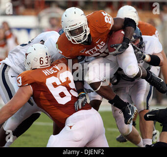 Sep 22, 2007 - Austin, TX, USA - NCAA Football: Texas Longhorns #25 Jamaal Charles leaps over his teammate #63Michale Huey near the goal line to score a touchdown in the 2nd quarter of play against Rice Owls at Darrell Royal Texas Memorial Stadium. The Texas Longhorns beat Rice 58-14. (Credit Image: © Delcia Lopez/San Antonio Express-News/ZUMA Press) RESTRICTIONS: US Tabloid Sales  Stock Photo