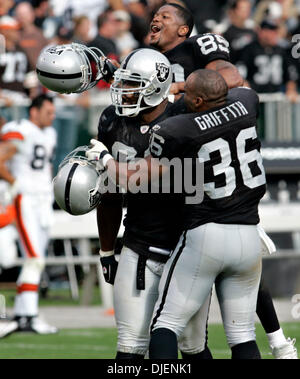 SUNDAY SEPT. 23, 2007 OAKLAND, CA. -  Ronald Curry, 89, and Justin Griffith celebrate the victory after Tommy Kelly, middle, blocked Cleveland's field goal attempt with seconds remaining..Jorgen Gulliksen/Register.all names cq. (Credit Image: © Napa Valley Register/ZUMApress.com) Stock Photo