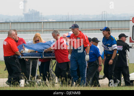 Sep 23, 2007 - Dallas, Texas, USA - NHRA drag racer John Force is airlifted after his devistating accident during the NHRA Fall Nationals in Dallas. Force broke his left ankle, critically dislocated his left wrist and suffered a severe abrasion to his right knee during a run with fellow NHRA legend Kenny Bernstein when His tire blew up at 315 mph. . PICTURED: front axel of his car. Stock Photo