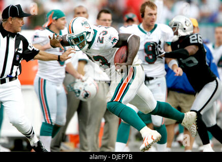 A photograph on display of former Miami Dolphins running back Jim Kiick,  full back Larry Csonka, center, and running back Mercury Morris, right, at  Independence Hall assisted living facility in Wilton Manors