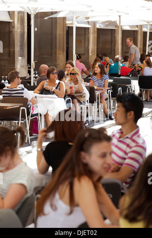 People eating on terrace in Plaza Real, Barcelona Stock Photo