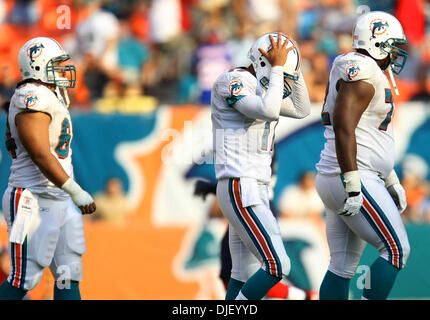 Miami Dolphins quarterback Cleo Lemon (17) fumbles the football in the  first quarter as New England Patriots linebacker Rosevelt Colvin (59) looks  on during a football game at Dolphin Stadium in Miami