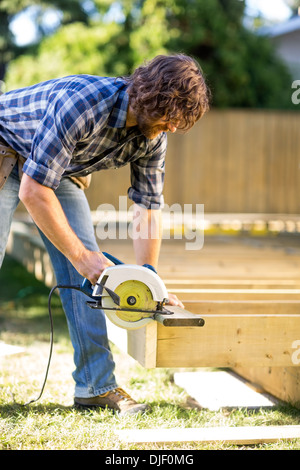 Carpenter Using Circular Saw Stock Photo