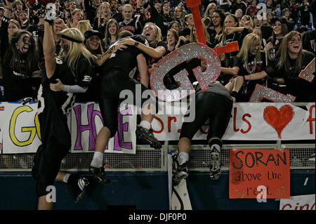 Nov 23, 2007 - Minneapolis, Minnesota, USA - Eden Prairie fans embrace members of the team who jumped into the stands following their 50-21 victory over Cretin-Derham Hall in the Class 5A Championship game of the 2007 Minnesota State High School State Football Tournament at the Metrodome Friday, November 23.  (Credit Image: © Jim Gehrz/Minneapolis Star Tribune/ZUMA Press) RESTRICTI Stock Photo