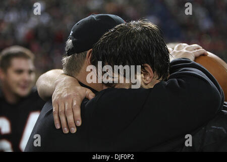 Nov 23, 2007 - Minneapolis, Minnesota, USA - Eden Prairie head coach Mike Grant embraced quarterback Ryan Grant after the teamâ€™s 50-21 victory over Cretin-Derham Hall in the Class 5A Championship game of the 2007 Minnesota State High School State Football Tournament at the Metrodome Friday, November 23.  (Credit Image: © Jim Gehrz/Minneapolis Star Tribune/ZUMA Press) RESTRICTIONS Stock Photo