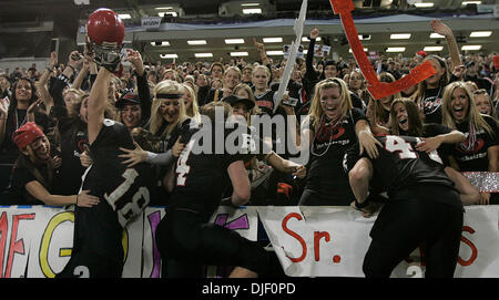 Nov 23, 2007 - Minneapolis, Minnesota, USA - Eden Priarie fans embrace members of the team who jumped into the stands following their 50-21 victory over Cretin-Derham Hall in the Class 5A Championship game of the 2007 Minnesota State High School State Football Tournament at the Metrodome Friday, November 23. (Credit Image: © Jim Gehrz/Minneapolis Star Tribune/ZUMA Press) RESTRICTIO Stock Photo