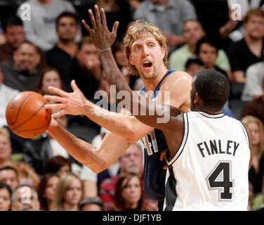 Dallas Mavericks' Dirk Nowitzki Guards San Antonio Spurs' Tim Duncan At 