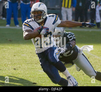 Dec 30, 2007 - OAKLAND, CA, USA - Oakland Raiders linebacker KIRK MORRISON #52 tries to stop San Diego Chargers running back DARREN SPROLES #43 during their game at McAfee Coliseum. (Credit Image: © Al Golub/ZUMApress.com) Stock Photo