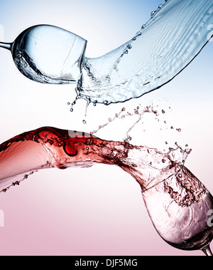 Splashes of glasses of water and wine Stock Photo