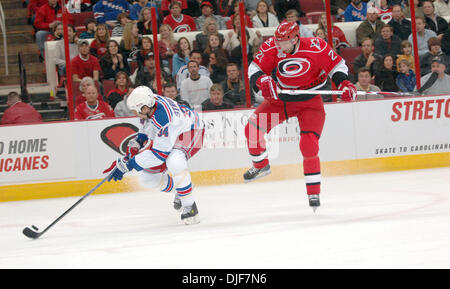 Jan 29, 2008 - Raleigh, North Carolina, USA - Carolina Hurricanes (26) ERIK COLE leaps in the air as New York Rangers (34) JASON STRUDWICK takes a shot at the goal. The Carolina Hurricanes defeated the New York Rangers with a final score of 3-1 at the RBC Center located in Raleigh. (Credit Image: © Jason Moore/ZUMA Press) Stock Photo