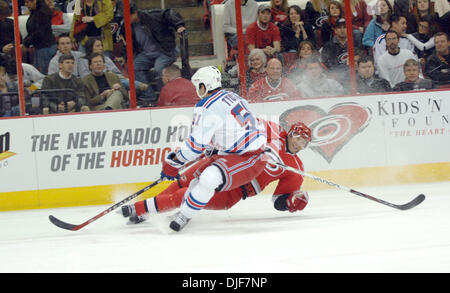 Jan 29, 2008 - Raleigh, North Carolina, USA - Carolina Hurricanes (26) ERIK COLE slides on the ice while in action with New York Rangers (51) FEDOR TYUTIN. The Carolina Hurricanes defeated the New York Rangers with a final score of 3-1 at the RBC Center located in Raleigh. (Credit Image: © Jason Moore/ZUMA Press) Stock Photo