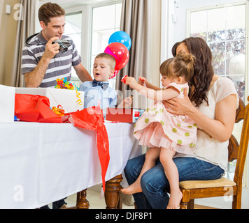 Family Opening Birthday Presents Stock Photo