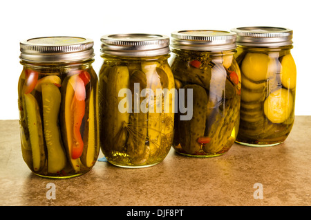 Homemade pickles in mason jars on a kitchen counter Stock Photo