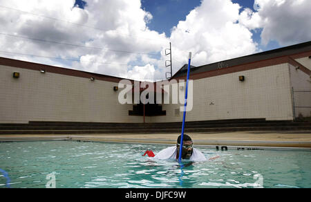 Jun. 04, 2010 - Memphis, Tn, U.S. - 4 june 10 (mwpool) Photo by Mark Weber - Lester Community Center pool manager Daniel Young does a final sweep for leaves as he prepares for the season opening. Young who grow up swimming in this pool, has worked there since 1982 when he was 18 years old. The pool will officially open for the summer season on Saturday at 1:00 pm along with 15 othe Stock Photo