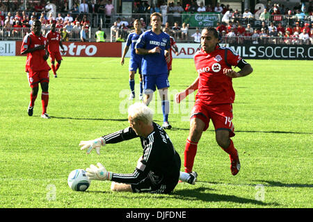 June 05, 2010 - Toronto, Ontario, Canada - 5 June 2010: Wizard keeper Jimmy Nielson (1) covers the ball  as Toronto FC forward Dwayne De Rosario (14) arrives late during the second half. The Toronto FC tied the Wizards 0-0. The game was played at BMO Field in Toronto, Ontario. (Credit Image: © Steve Dormer/Southcreek Global/ZUMApress.com) Stock Photo