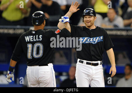 June 06, 2010 - Toronto, Ontario, Canada - 06 June 2010: Toronto Blue Jays center fielder Vernon Wells (10) is congratulated by teammate Lyle Overbay (right) after hitting a 2-run home run during Sunday's baseball game, where the New York Yankees defeated the Toronto Blue Jays 4-3 at the Rogers Centre in Toronto, Ontario. (Credit Image: © Adrian Gauthier/Southcreek Global/ZUMApress Stock Photo