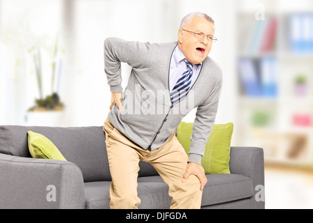 Senior man suffering from back pain Stock Photo