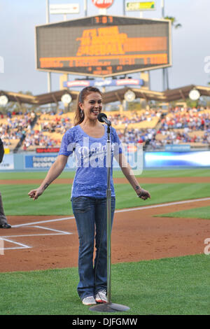 June 11, 2010 - Los Angeles, California, U.S - 11 June 2010:  Actress and star of ''Romantically Challenged'' Alyssa Milano announces ''Its Time for Dodger Baseball'' prior to the game. The Los Angeles Angels defeated the Los Angeles Dodgers by a score of 10-1,  at Dodger Stadium in Los Angeles, California. .Mandatory Credit: Andrew Fielding / Southcreek Global (Credit Image: © And Stock Photo