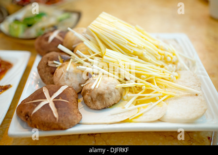 variety of fresh mushrooms in the plate inside. Ready for the grill. Stock Photo