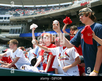 Actress Alyssa Milano signs autographs for fans in the St. Louis Cardinals  team store during an unveiling of her new clothing line of women's baseball  apparel at Busch Stadium in St. Louis