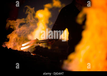 Jul 10, 2010 - Calgary, Alberta, Canada - Will O'Shaughnessy from Ireland pulls his horseshoe from a forge while competing in the 31st World Championship Blacksmiths' Competition held at Canada's Calgary Stampede, one of the largest rodeos in the world. (Credit Image: © John Goodman/ZUMApress.com) Stock Photo