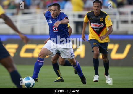 Cruz Azul forward Christian Gimenez and Club America defender Enrique  Esqueda battle for a loose ball in the second half of .a friendly match at  the Rose Bowl in Pasadena, California. (Credit