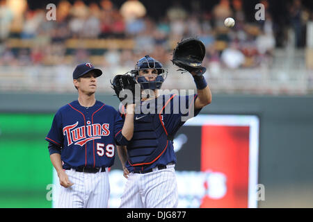 July 15, 2010 - Minneapolis, Minnesota, United States of America - 15 July 2010:   Minnesota Twins starting pitcher Kevin Slowey #59 and catcher Joe Mauer #7 on the mound in the 2nd inning of the Twins'  baseball game against the Chicago White Sox at Target Field in Minneapolis, Minnesota.    .Mandatory Credit: Marilyn Indahl / Southcreek Global. (Credit Image: © Southcreek Global/ Stock Photo