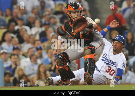 July 20, 2010 - Los Angeles, California, United States of America - 20 July 2010: Los Angeles Dodgers center fielder Xavier Paul (30) slides in safely behind the potential tag from San Francisco Giants catcher Buster Posey (28). The San Francisco Giants defeated the Los Angeles Dodgers, 7-5, at Dodger Stadium in Los Angeles, California. Mandatory Credit: Andrew Fielding / Southcree Stock Photo