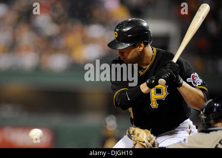 St. Louis Cardinals catcher Yadier Molina throws the baseball to first base  after a bunt by Pittsburgh Pirates Jason Jaramillo in the fourth inning at  Busch Stadium in St. Louis on May