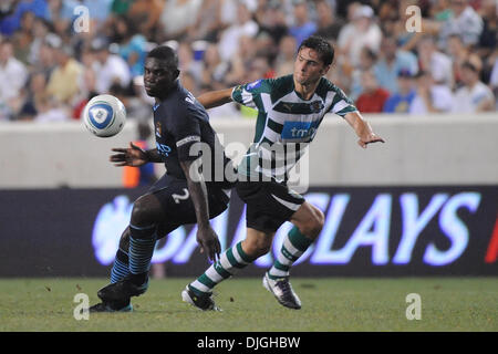 July 23, 2010 - Harrison, New Jersey, United States of America - 23 July 2010 - Sporting Forward Heldar Postiga (#23) and Manchester City Defender Micah Richards (#2) battle for possession as English Premier League Club Manchester City face Sporting Club de Portugal in the second match of The Barclays New York Football Challenge at Red Bull Stadium in Harrison, New Jersey. Sporting Stock Photo