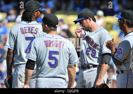 Matt Harvey, David Wright, Curtis Granderson from the Mets stand with  Justin and Jaden Ramos who join their mother Maritza Ramos and the family  of Wenjian Liu when they throw out the