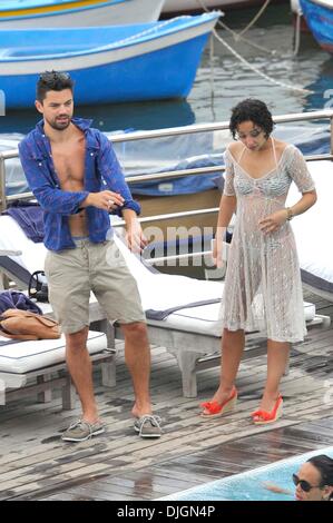 Dominic Cooper and his girlfriend Ruth Negga enjoy a holiday poolside at hotel Della Regina Isabella Ischia, Italy - 12.07.12 Stock Photo