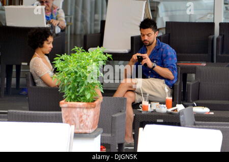 Dominic Cooper and his girlfriend Ruth Negga enjoy a holiday poolside at hotel Della Regina Isabella Ischia, Italy - 12.07.12 Stock Photo