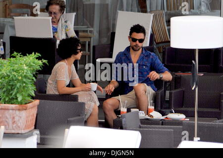 Dominic Cooper and his girlfriend Ruth Negga enjoy a holiday poolside at hotel Della Regina Isabella Ischia, Italy - 12.07.12 Stock Photo