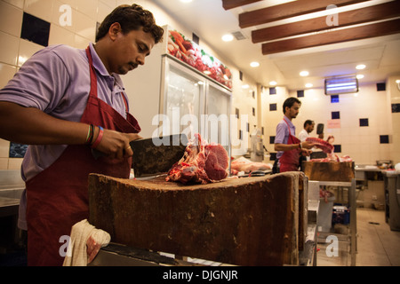 Asian butcher chopping raw meat on a cutting board Stock Photo - Alamy