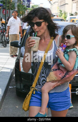 Cobie Smulders leaving a Starbucks with her daughter Shaelyn Cado Killam in Soho, Manhattan. New York City, USA – 24.07.12 Stock Photo