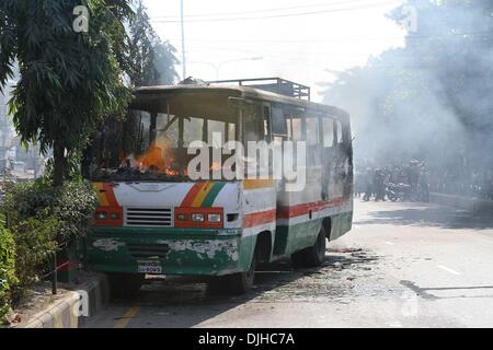 Dhaka, Bangladesh . 28th Nov, 2013. Bangladeshi firefighters inspect a charred bus set ablaze by supporters of the opposition Bangladesh Nationalist Party (BNP) during a blockade in Dhaka on November 28, 2013. A United Nations envoy will visit Bangladesh to hold talks with political parties about ending an election standoff that has sparked deadly violence, an official said Thursday. Stock Photo