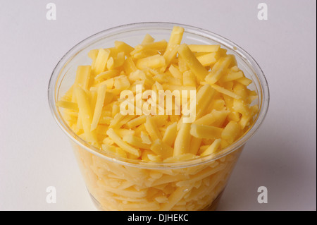 Grated cheddar cheese in plastic container Stock Photo - Alamy