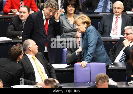 German Chancellor Angela Merkel, center, is dressed in a bullet proofed ...