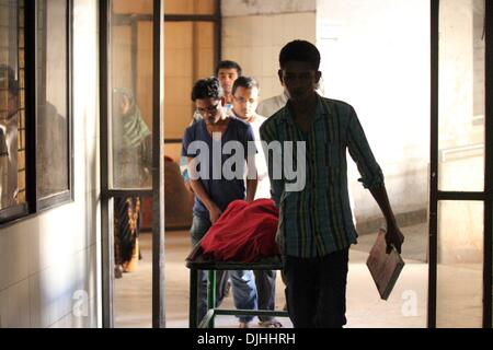 Dhaka, Bangladesh . 28th Nov, 2013. The body of Mojjammal, 19, who suffered burn injuries November 28caused by supporters of the opposition Bangladesh Nationalist Party (BNP) during a blockade, is pictured at the morgue of the Dhaka Medical College Hospital in Dhaka on November 28, 2013. A United Nations envoy will visit Bangladesh to hold talks with political parties about ending an election standoff that has sparked deadly violence, an official said Thursday. Stock Photo