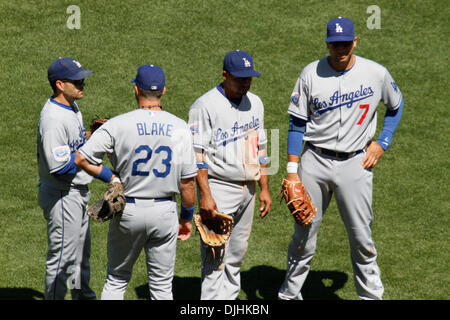 July 31, 2010 - San Francisco, California, United States of America - 31-July-2010: San Francisco, CA:   San Francisco Giants Hosts the Los Angeles Dodgers.  Los Angeles Dodgers third baseman Casey Blake (23) and his team mates wait as the relieve pitcher warms up during the game against the San Francisco Giants.  San Francisco Giants win the game 2-1.  Mandatory Credit: Dinno Kovi Stock Photo