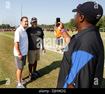 Aug. 04, 2010 - Georgetown, KY, USA - University of Kentucky basketball coach John Calipari had his photo taken with Cincinnati Bengals head coach Marvin Lewis at the Cincinnati Bengals pre-season training camp held at Georgetown College in Georgetown, Ky., Wednesday, August 04, 2010. The Bengals open their regular season on Sept. 12 at the New England Patriots. Taking the photo on Stock Photo